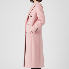 Beige women’s coat with lapel collar and button fastening by THE WHITMORE FAMILY, displayed on a hanger.