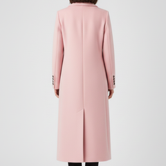 Beige women’s coat with lapel collar and button fastening by THE WHITMORE FAMILY, shown hanging on a white background.