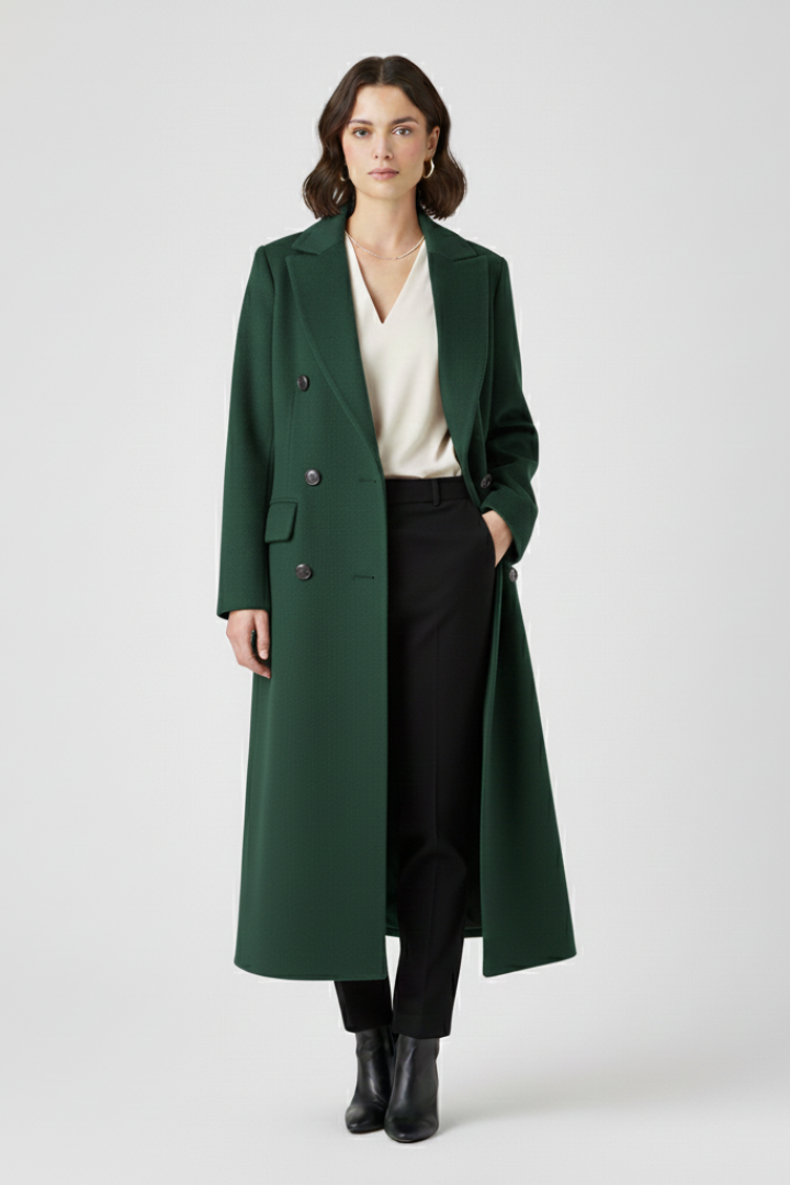 Beige women’s coat by THE WHITMORE FAMILY featuring a lapel collar and button fastening, stylish and suitable for cool weather.