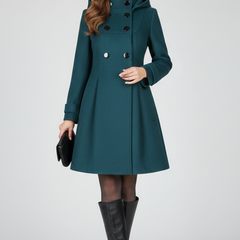 Black women’s coat with hood and double button front from THE WHITMORE FAMILY, featuring a stylish and warm outerwear design.