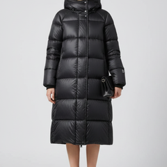Women’s black down coat with hood and quilted surface from THE WHITMORE FAMILY, stylish winter outerwear for women.