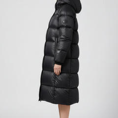 Women’s black down coat with hood and quilted surface by THE WHITMORE FAMILY, featuring a warm, insulated winter outerwear design.