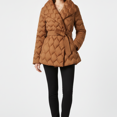 Women’s caramel down coat by THE WHITMORE FAMILY featuring a belted waist and deep front pockets, perfect for cold weather.