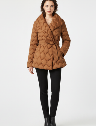 Women’s caramel down coat by THE WHITMORE FAMILY featuring a belted waist and deep front pockets, perfect for cold weather.