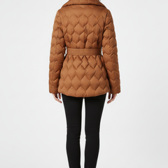 Women’s caramel down coat by THE WHITMORE FAMILY with belted waist and deep pockets, shown on a model.