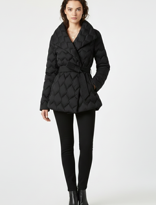 Women's down coat by THE WHITMORE FAMILY in caramel with a belted waist and deep pockets, shown on a model.