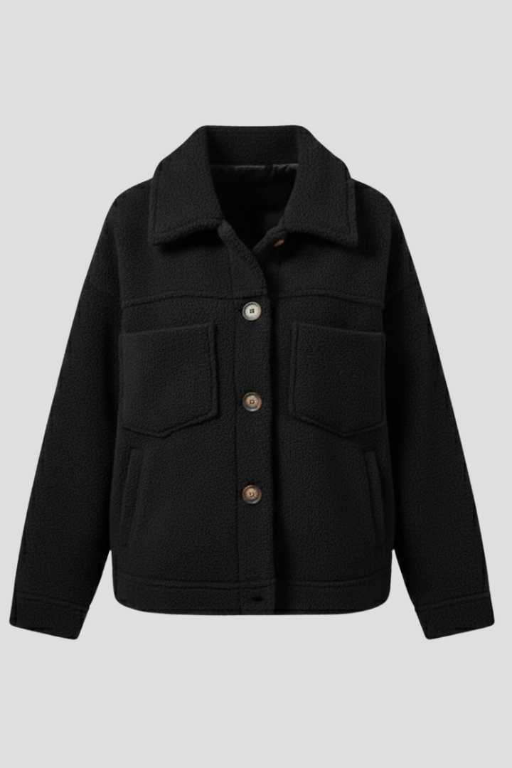 Women’s black fleece jacket by THE WHITMORE FAMILY featuring buttons and large pockets, casual and cozy outerwear for women.