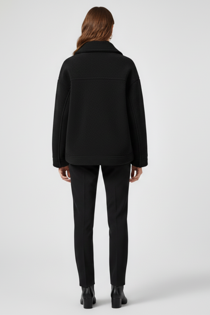 Women’s black fleece jacket by THE WHITMORE FAMILY featuring buttons and large front pockets, perfect for casual wear.