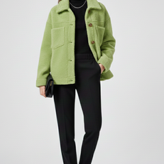 Women’s black fleece jacket by THE WHITMORE FAMILY featuring buttons and large pockets, ideal for casual wear and warmth.