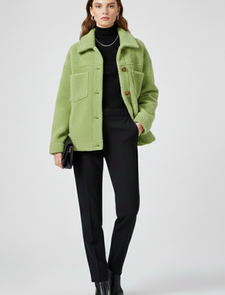 Women’s black fleece jacket by THE WHITMORE FAMILY featuring buttons and large pockets, ideal for casual wear and warmth.
