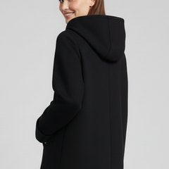 Women's hooded jacket with zip closure and side pockets, stylish outerwear from THE WHITMORE FAMILY.