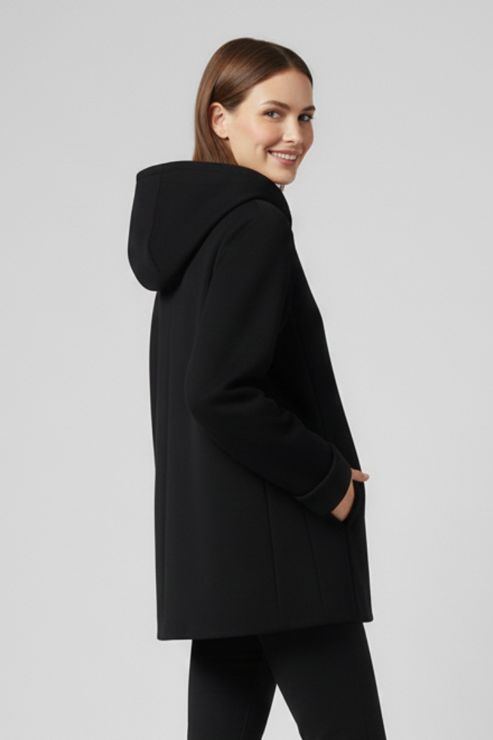 Women’s hooded jacket with front zipper and side pockets, stylish and comfortable outerwear by THE WHITMORE FAMILY.