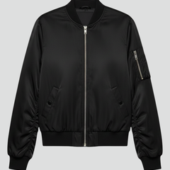 Women’s black bomber jacket by THE WHITMORE FAMILY with zipper closure and ribbed details, stylish women’s jacket for casual wear.