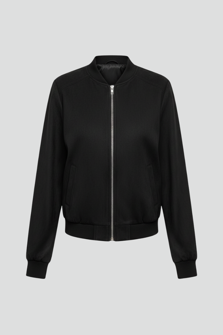 Women’s black bomber jacket by THE WHITMORE FAMILY with zip closure and ribbed edges, shown on a model.