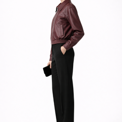 Women’s burgundy bomber jacket by THE WHITMORE FAMILY with zip closure and elasticated hem, lightweight and stylish women's jacket.