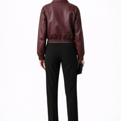 Women's burgundy bomber jacket by THE WHITMORE FAMILY with zip closure and elasticated hem, stylish and casual outerwear.