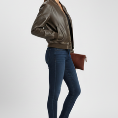 Women's bomber jacket with collared neck and woven outer surface by THE WHITMORE FAMILY, shown in a coffee color.
