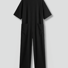 Women’s jumpsuit by THE WHITMORE FAMILY featuring a round neck and wide-leg trousers, shown in a stylish, comfortable fit.
