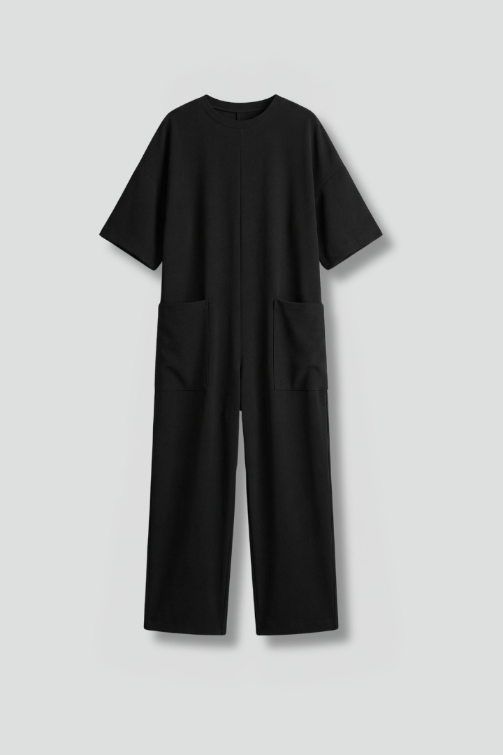 Women’s jumpsuit by THE WHITMORE FAMILY featuring a round neck and wide-leg trousers, shown in a stylish, comfortable fit.