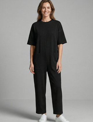 Women’s jumpsuit with round neck and wide-leg trousers from THE WHITMORE FAMILY, stylish and comfortable for casual wear.