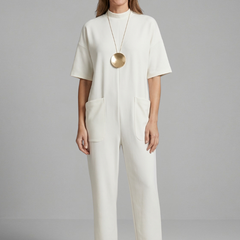 Women’s jumpsuit by THE WHITMORE FAMILY featuring a round neck and wide leg trousers, styled for a casual or chic look.
