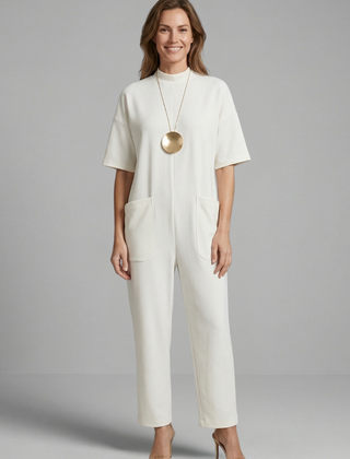 Women’s jumpsuit by THE WHITMORE FAMILY featuring a round neck and wide leg trousers, styled for a casual or chic look.