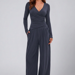 Women's lounge set featuring a wrap top and wide-leg pants by THE WHITMORE FAMILY, comfortable and stylish for relaxed wear.