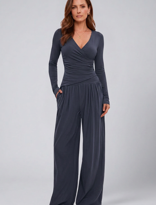 Women's lounge set featuring a wrap top and wide-leg pants by THE WHITMORE FAMILY, comfortable and stylish for relaxed wear.