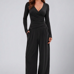 Women’s lounge set with wrap top and wide-leg pants by THE WHITMORE FAMILY, shown as a comfortable, stylish jumpsuit.