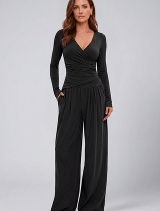 Women’s lounge set with wrap top and wide-leg pants by THE WHITMORE FAMILY, shown as a comfortable, stylish jumpsuit.