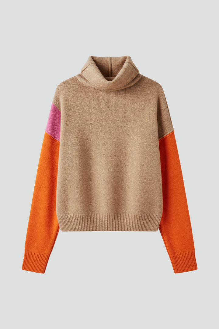 Women’s knit sweater with high collar and ribbed cuffs, from THE WHITMORE FAMILY, showcasing a cozy, stylish winter top.