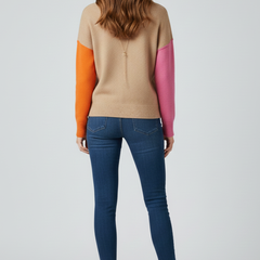 Women’s knit sweater with high collar and ribbed cuffs, by THE WHITMORE FAMILY, showing a cozy, fitted design in soft yarn.