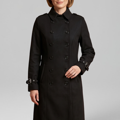 Women’s long black coat by THE WHITMORE FAMILY with double-breasted buttons and long sleeves, stylish and warm for winter wear.