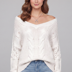 Women’s oversized sweater with long sleeves and ribbed cuffs, stylish and cozy, from THE WHITMORE FAMILY.