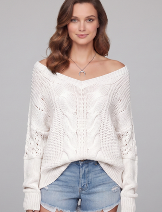 Women’s oversized sweater with long sleeves and ribbed cuffs, stylish and cozy, from THE WHITMORE FAMILY.