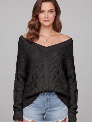 Women’s oversized sweater with long sleeves and ribbed cuffs, stylish and cozy, by THE WHITMORE FAMILY.