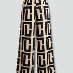 Women’s Palazzo Trousers with graphic print and wide legs by THE WHITMORE FAMILY, dark brown color, stylish and comfortable.