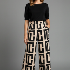 Women’s Palazzo Trousers by THE WHITMORE FAMILY with graphic print and wide-leg design in dark brown fabric.