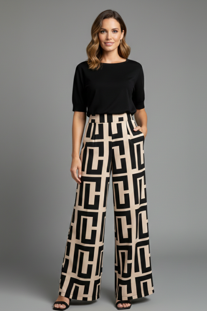 Women’s Palazzo Trousers by THE WHITMORE FAMILY with graphic print and wide-leg design in dark brown fabric.