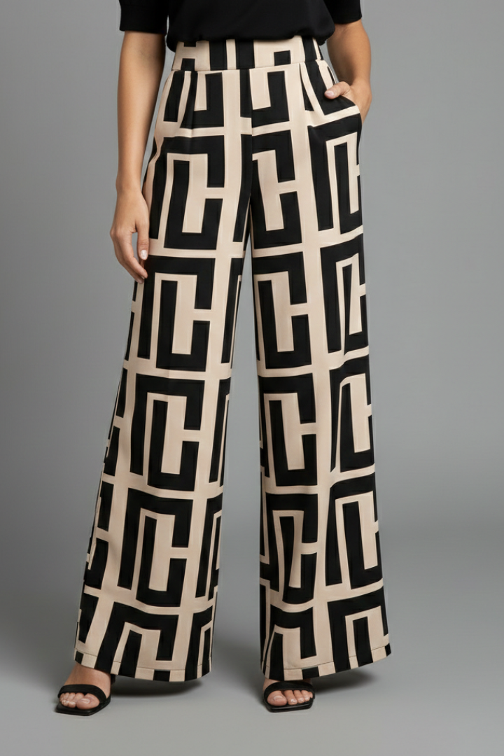 Women’s Palazzo Trousers by THE WHITMORE FAMILY featuring dark brown fabric, graphic print, and wide-leg style.