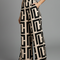 Dark brown women’s Palazzo Trousers by THE WHITMORE FAMILY with graphic print and wide-leg design, styled for casual wear.