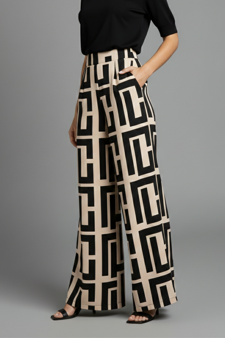 Dark brown women’s Palazzo Trousers by THE WHITMORE FAMILY with graphic print and wide-leg design, styled for casual wear.