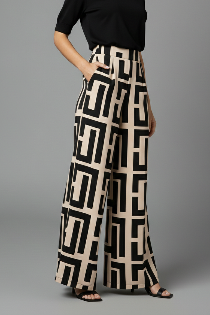Women’s Palazzo Trousers by THE WHITMORE FAMILY featuring dark brown color, graphic print, and wide-leg design.