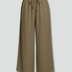 Women’s Palazzo Trousers by THE WHITMORE FAMILY with elastic waist and side pockets, shown in a stylish and comfortable fit.