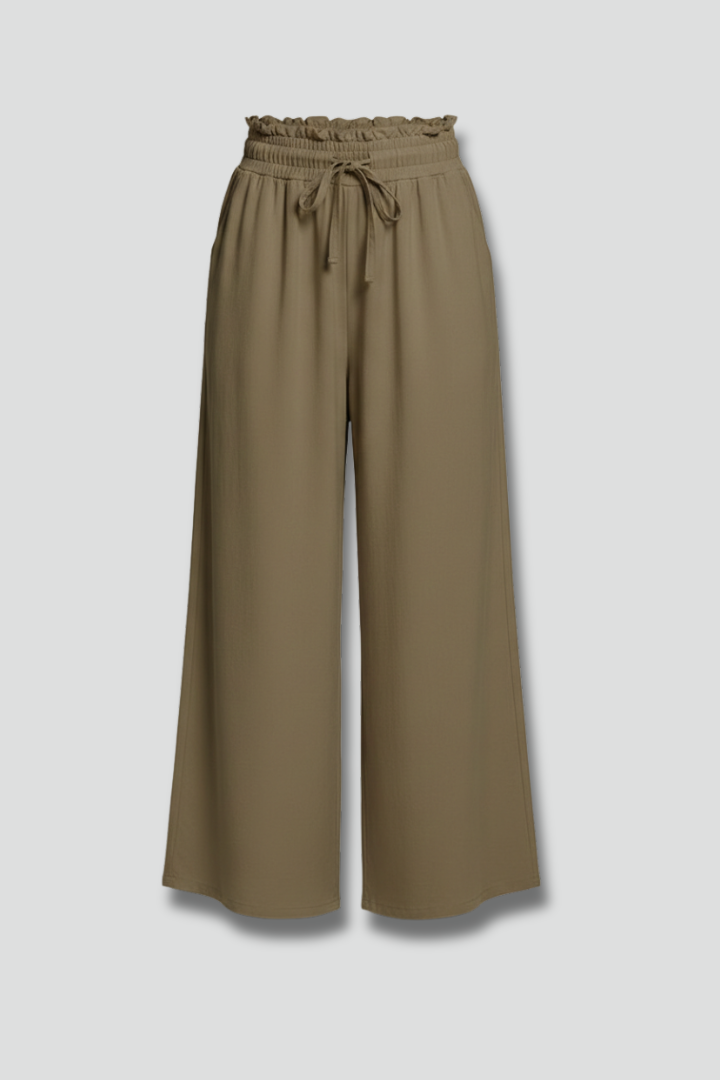 Women’s Palazzo Trousers by THE WHITMORE FAMILY with elastic waist and side pockets, shown in a stylish and comfortable fit.