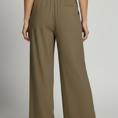 Women’s Palazzo Trousers by THE WHITMORE FAMILY with elastic waist and side pockets, shown in a relaxed fit style.