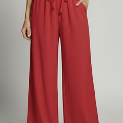 Women’s Palazzo Trousers by THE WHITMORE FAMILY with elastic waist and side pockets, shown in a relaxed fit and stylish design.
