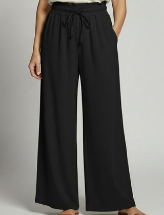 Women’s Palazzo Trousers with elastic waist and side pockets, stylish and comfortable pants by THE WHITMORE FAMILY.