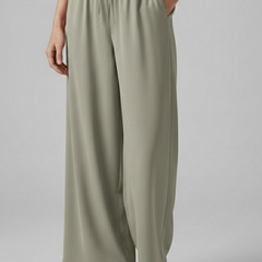 Pink women's Palazzo trousers with elastic waist and side pockets by THE WHITMORE FAMILY, comfortable and stylish for casual wear.