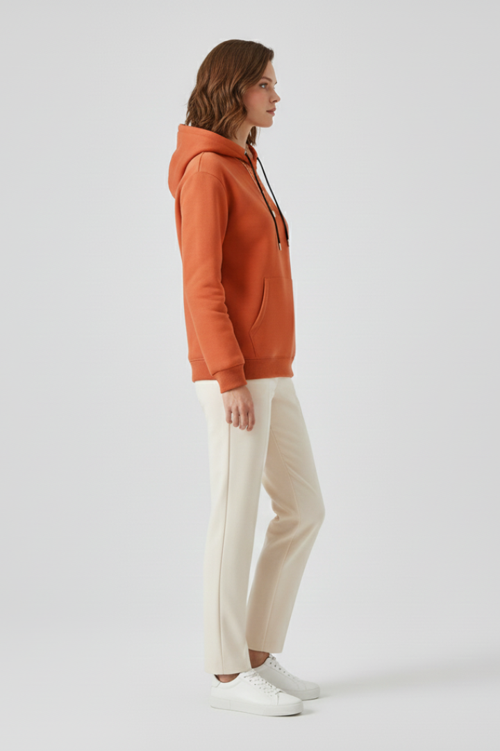 Women’s pullover hoodie with sherpa lining and ribbed cuffs, stylish and cozy sweater from THE WHITMORE FAMILY.